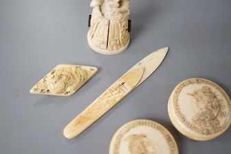 A pair of 19th century ivory balm pots, 3.75cm., a smallDieppe triptych figure, 6.5cm. a Meiji tiger brooch and a Dutch page marker.